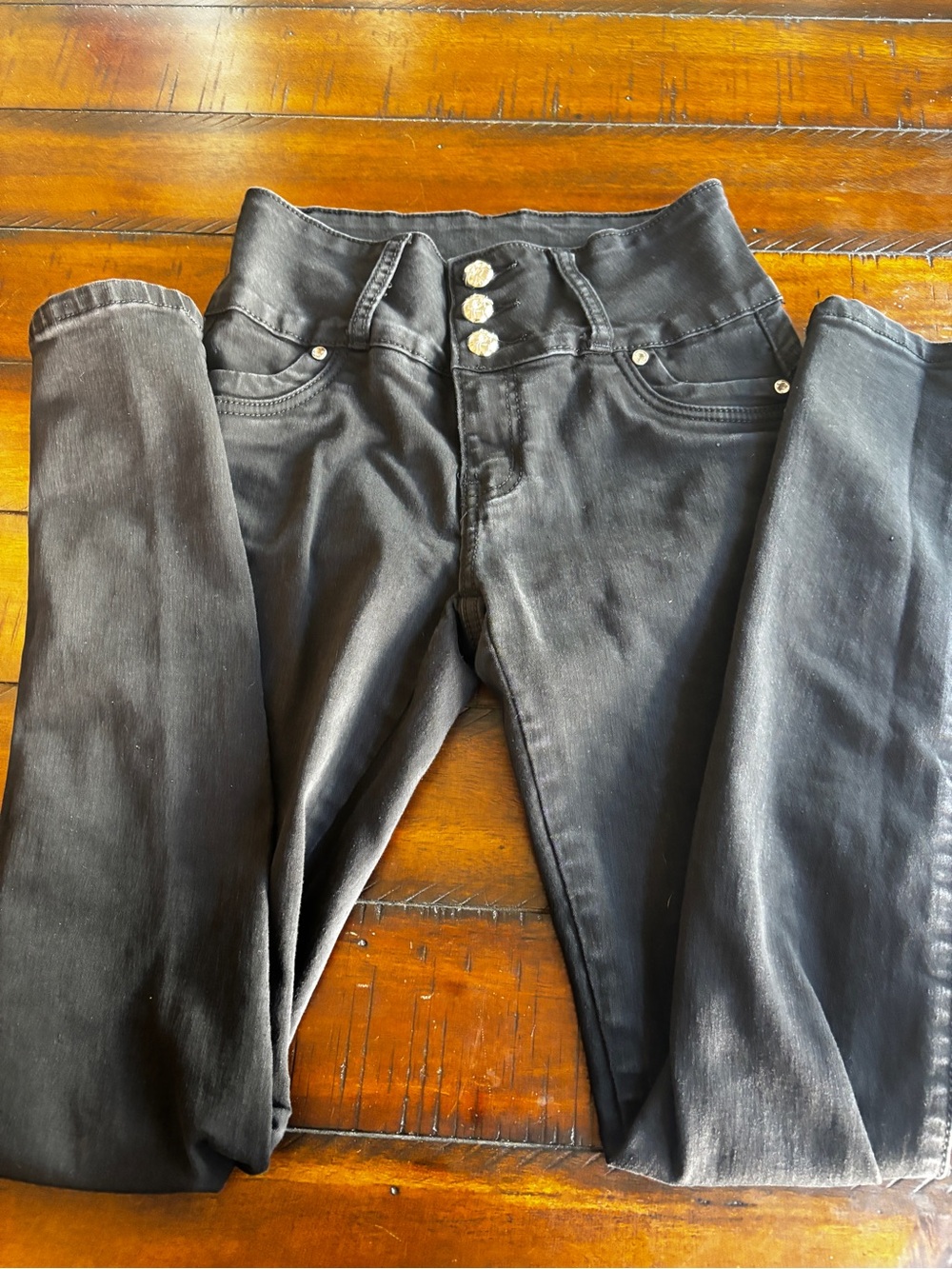 High-Rise Black Skinny Jeans with Triple Button Detail